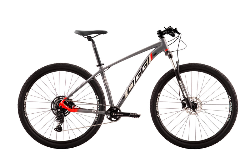 Bicicleta Oggi 29 Big Wheel 7.0 Shimano Cues 9V Grafite/Verm/Cinza Tam. 17 2024